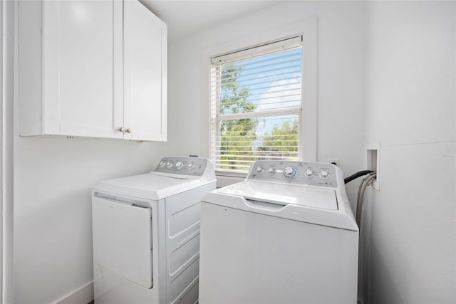 2214 Stevens St, Houston, TX 77026 - washroom with a healthy amount of sunlight, separate washer and dryer, and cabinet space