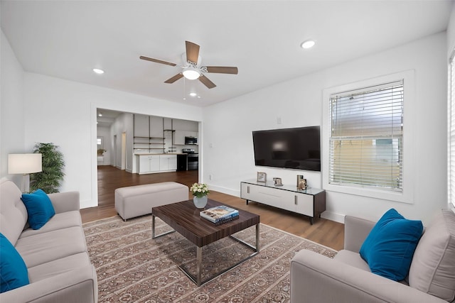 2214 Stevens St, Houston, TX 77026 - living area featuring wood finished floors, a ceiling fan, recessed lighting, and baseboards