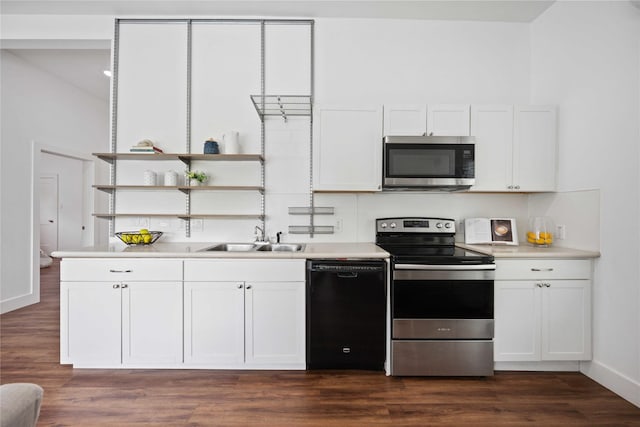2214 Stevens St, Houston, TX 77026 - kitchen featuring white cabinetry, stainless steel appliances, light countertops, and a sink