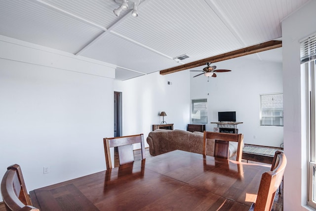 140 Ocean View Dr, Crystal Beach, TX 77650 - dining space featuring ceiling fan, a fireplace, and wood finished floors