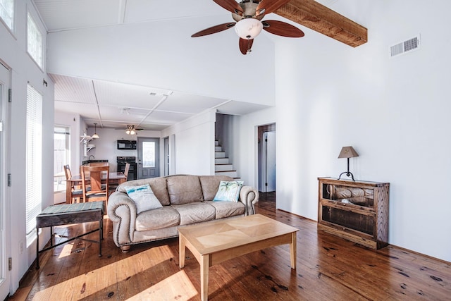 140 Ocean View Dr, Crystal Beach, TX 77650 - living room featuring a ceiling fan, hardwood / wood-style floors, stairway, and high vaulted ceiling
