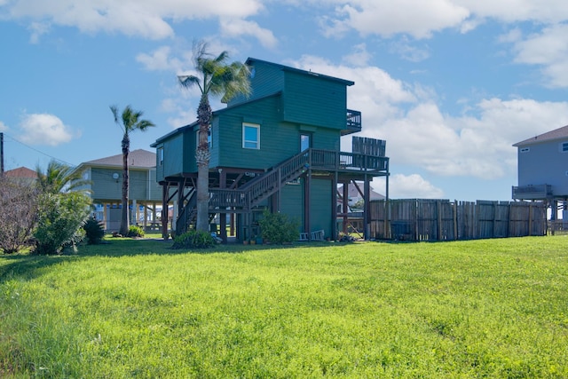 140 Ocean View Dr, Crystal Beach, TX 77650 - rear view of house with stairs and a wooden deck