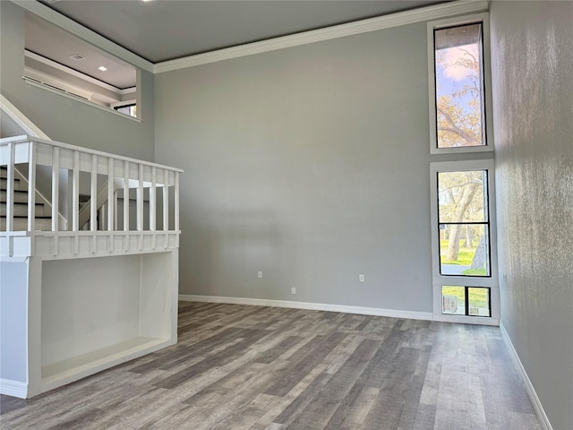266 Fawn Trl, Lake Jackson, TX 77566 - unfurnished bedroom with a high ceiling, ornamental molding, and baseboards