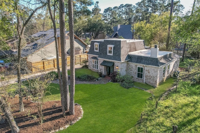 15407 Oaklawn Park Dr, Houston, TX 77069 - back of house featuring a shingled roof, brick siding, mansard roof, and a chimney