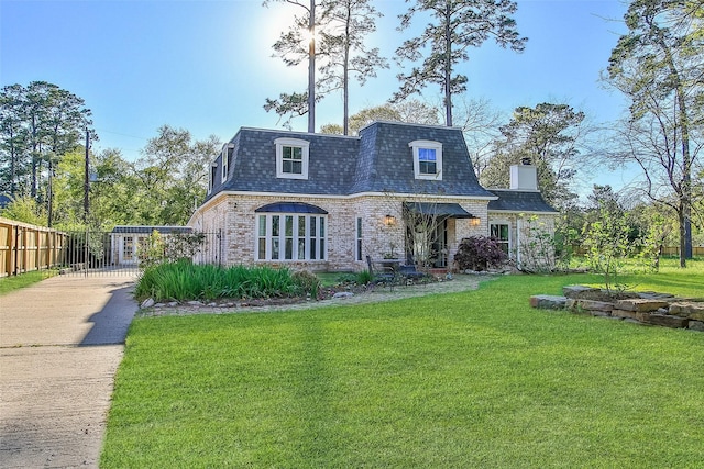 15407 Oaklawn Park Dr, Houston, TX 77069 - view of front of property with mansard roof, driveway, roof with shingles, and brick siding