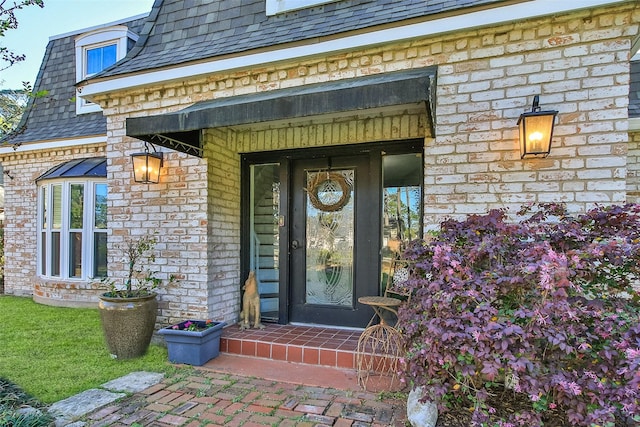 15407 Oaklawn Park Dr, Houston, TX 77069 - doorway to property with mansard roof and brick siding