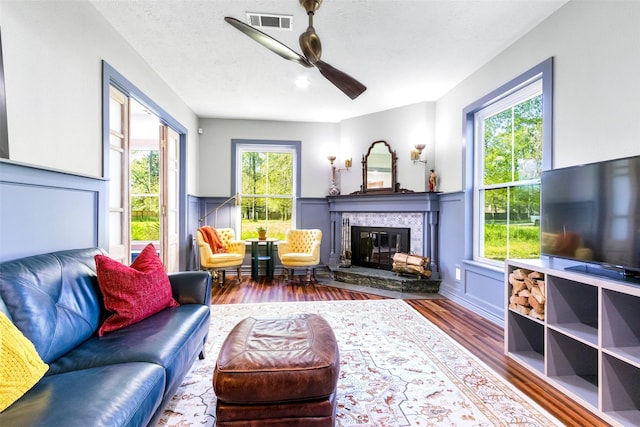 15407 Oaklawn Park Dr, Houston, TX 77069 - living room featuring wood finished floors, ceiling fan, and a fireplace