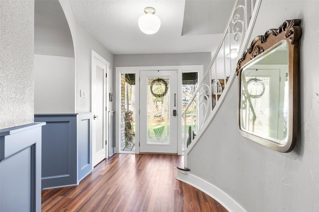 15407 Oaklawn Park Dr, Houston, TX 77069 - entryway with dark wood finished floors, stairs, and a textured wall