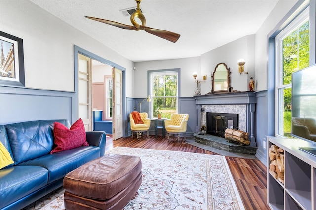 15407 Oaklawn Park Dr, Houston, TX 77069 - living room with a fireplace, a ceiling fan, and wood finished floors