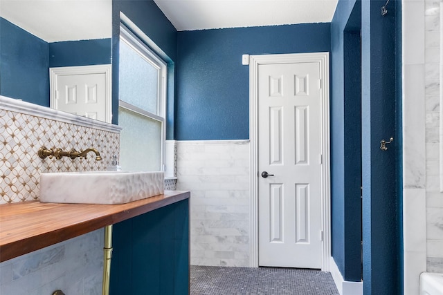 15407 Oaklawn Park Dr, Houston, TX 77069 - bathroom with tile walls, vanity, and wainscoting