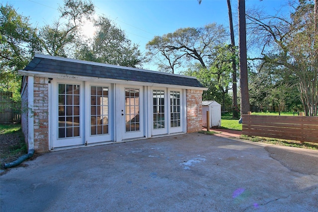 15407 Oaklawn Park Dr, Houston, TX 77069 - view of patio / terrace with an outdoor structure