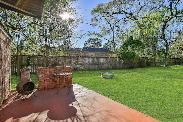 15407 Oaklawn Park Dr, Houston, TX 77069 - fenced backyard featuring a patio area and an outdoor fire pit