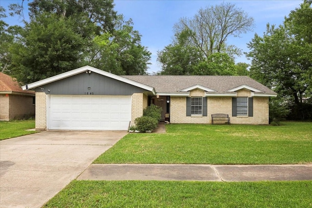 single story home with concrete driveway, brick siding, an attached garage, and a front yard