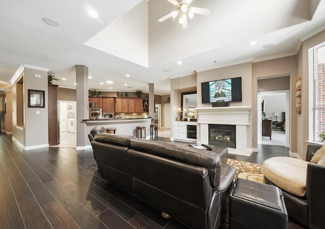 15502 Kellan Ct, Cypress, TX 77429 - living room with ceiling fan, a glass covered fireplace, crown molding, recessed lighting, and baseboards