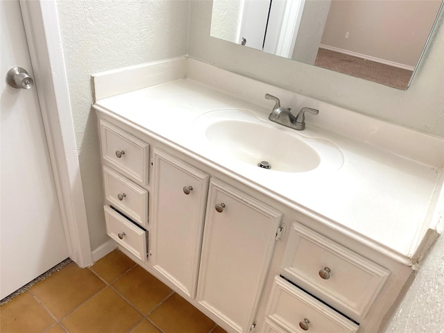 2414 Woven Wood Ln, Richmond, TX 77406 - bathroom featuring a textured wall, vanity, and tile patterned flooring