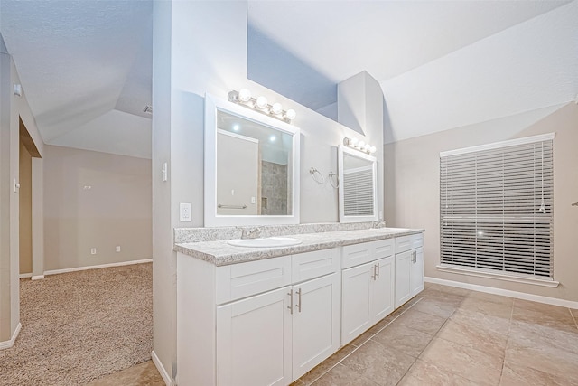 21403 Park Post Ln, Katy, TX 77450 - bathroom featuring lofted ceiling and double vanity