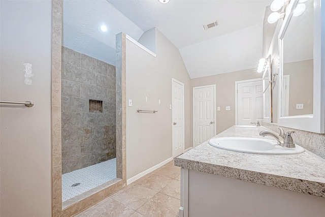 21403 Park Post Ln, Katy, TX 77450 - full bathroom featuring vaulted ceiling, double vanity, walk in shower, and tile patterned flooring