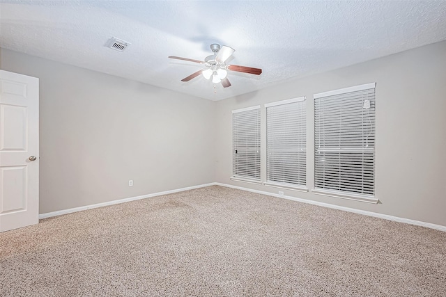 21403 Park Post Ln, Katy, TX 77450 - unfurnished room featuring carpet, a ceiling fan, and a textured ceiling