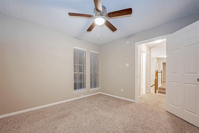21403 Park Post Ln, Katy, TX 77450 - unfurnished room with light carpet, a ceiling fan, and a textured ceiling