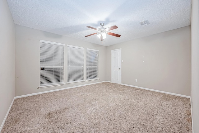 21403 Park Post Ln, Katy, TX 77450 - empty room featuring a ceiling fan, carpet flooring, and a textured ceiling