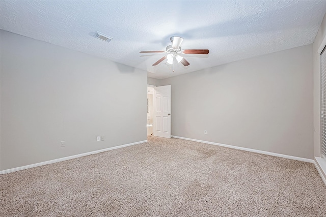 21403 Park Post Ln, Katy, TX 77450 - spare room featuring a ceiling fan, carpet floors, and a textured ceiling
