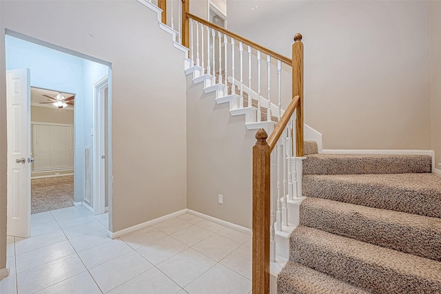 21403 Park Post Ln, Katy, TX 77450 - stairway with tile patterned flooring and a ceiling fan