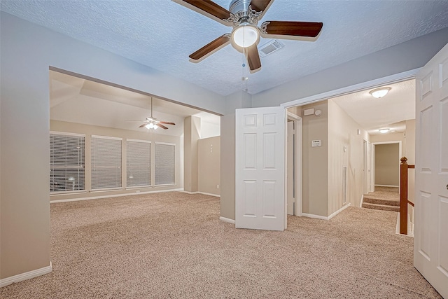 21403 Park Post Ln, Katy, TX 77450 - spare room featuring ceiling fan, carpet, and a textured ceiling