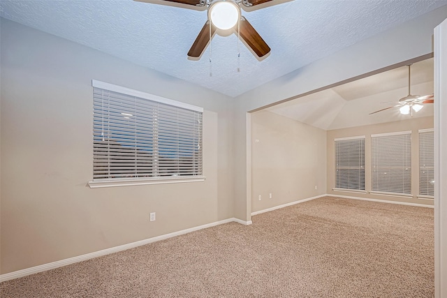 21403 Park Post Ln, Katy, TX 77450 - carpeted empty room with ceiling fan, lofted ceiling, and a textured ceiling