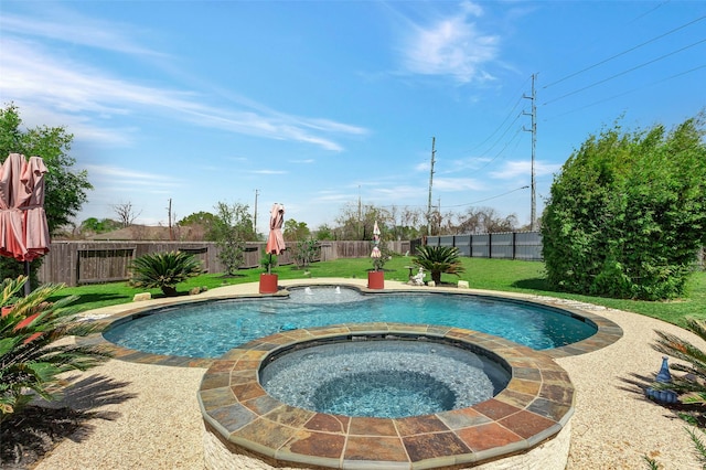 view of pool featuring a lawn, a pool with connected hot tub, and a fenced backyard