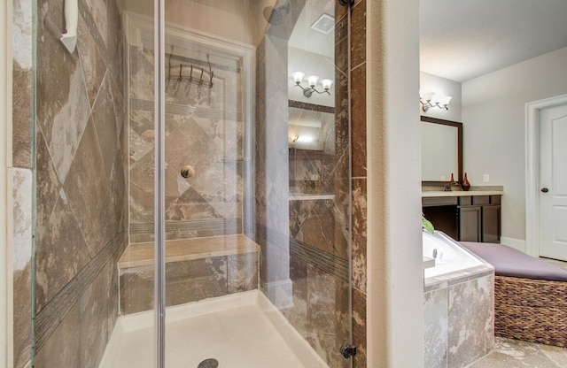 bathroom with visible vents, a shower stall, vanity, and a garden tub