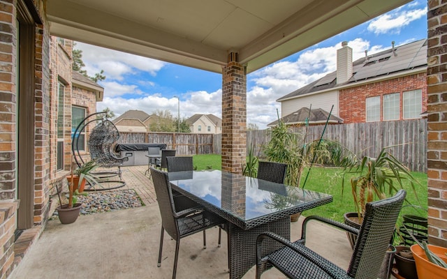 view of patio featuring outdoor dining space and a fenced backyard