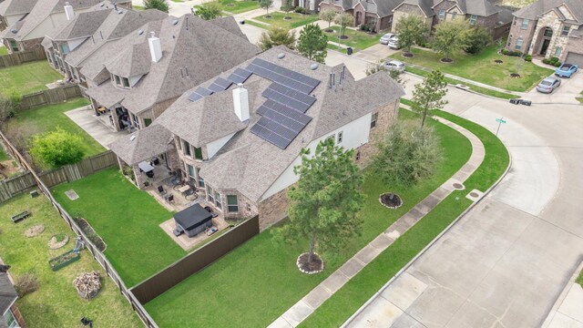 birds eye view of property with a residential view