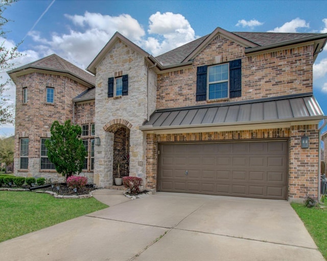 view of front of home featuring a standing seam roof, concrete driveway, a garage, stone siding, and metal roof