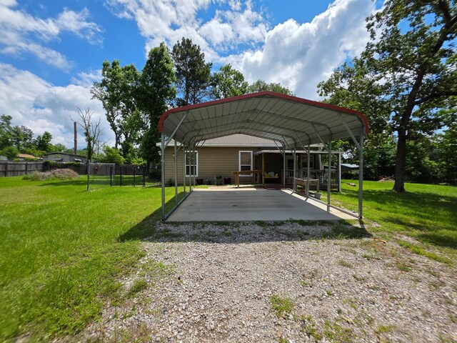 934 N Fm 356, Onalaska, TX 77360 - view of vehicle parking featuring a carport and gravel driveway