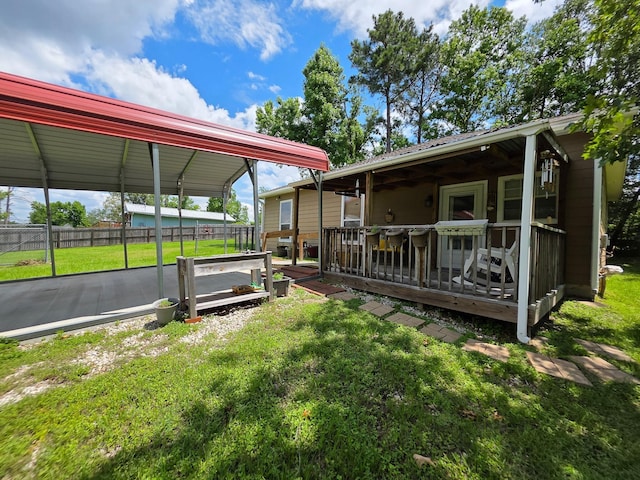 934 N Fm 356, Onalaska, TX 77360 - view of yard featuring a deck and a detached carport