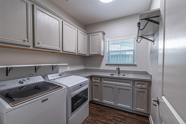 washroom with dark wood-style floors, cabinet space, independent washer and dryer, and a sink