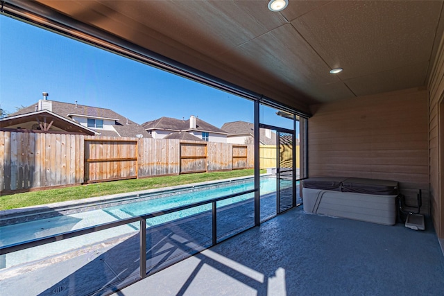 view of pool featuring fence and a residential view