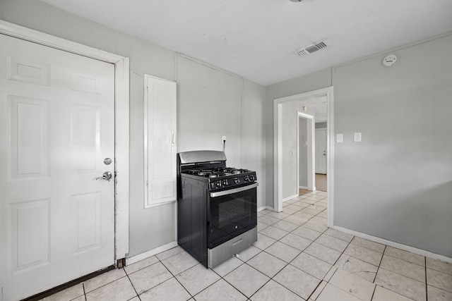 1017 Canadian St, Houston, TX 77009 - kitchen with black range with gas cooktop, visible vents, baseboards, and light tile patterned floors