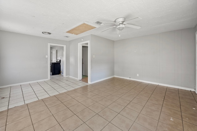 1017 Canadian St, Houston, TX 77009 - tiled spare room featuring baseboards, visible vents, a textured ceiling, and ceiling fan