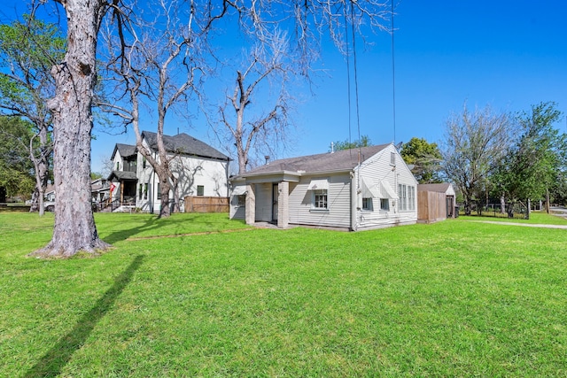 1017 Canadian St, Houston, TX 77009 - rear view of house featuring a yard and fence