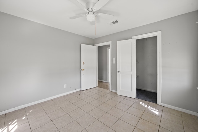 1017 Canadian St, Houston, TX 77009 - unfurnished bedroom featuring light tile patterned floors, visible vents, baseboards, and a ceiling fan