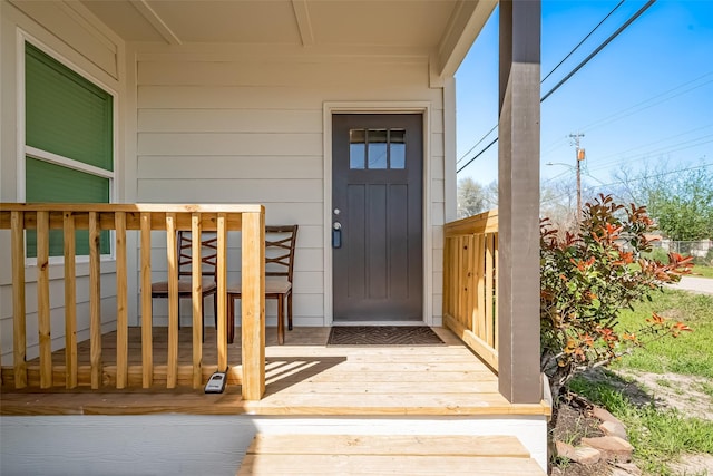 property entrance with a wooden deck