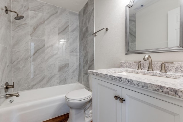 full bathroom with toilet, visible vents, washtub / shower combination, and vanity