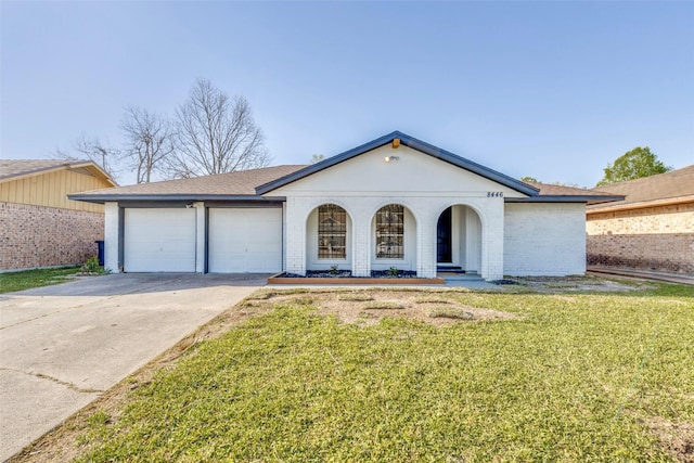 ranch-style home featuring an attached garage, driveway, a front lawn, and brick siding