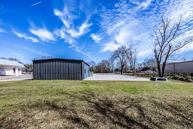 407 S Home St, Corrigan, TX 75939 - view of yard featuring an outbuilding, a garage, and an outdoor structure