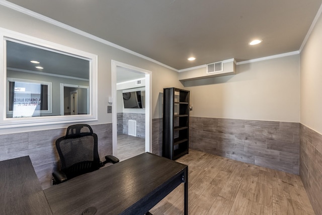 407 S Home St, Corrigan, TX 75939 - office area featuring tile walls, wood finished floors, visible vents, and wainscoting