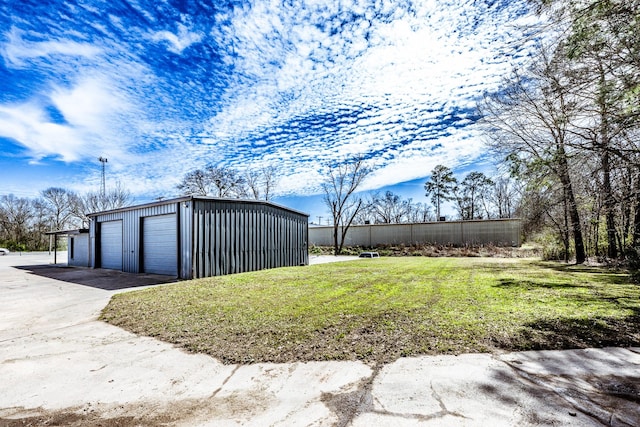407 S Home St, Corrigan, TX 75939 - exterior space featuring a garage and an outbuilding