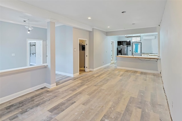 2025 Avenue N 1/2 Ave N 1/2, Galveston, TX 77550 - unfurnished living room featuring light wood-style floors, crown molding, baseboards, a sink, and recessed lighting