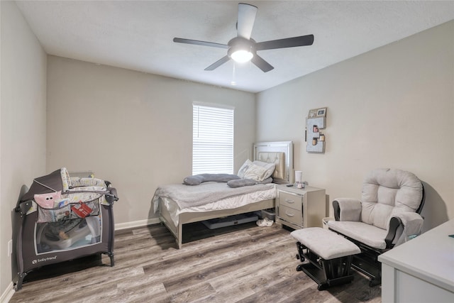 16439 Sunlamp Ct, Houston, TX 77095 - bedroom featuring baseboards, wood finished floors, and a ceiling fan