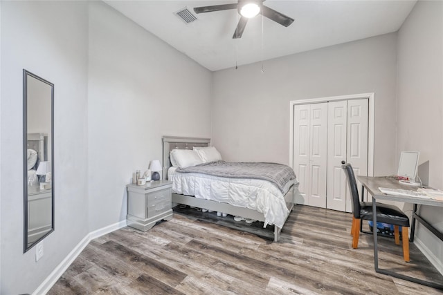 16439 Sunlamp Ct, Houston, TX 77095 - bedroom with a closet, baseboards, and wood finished floors